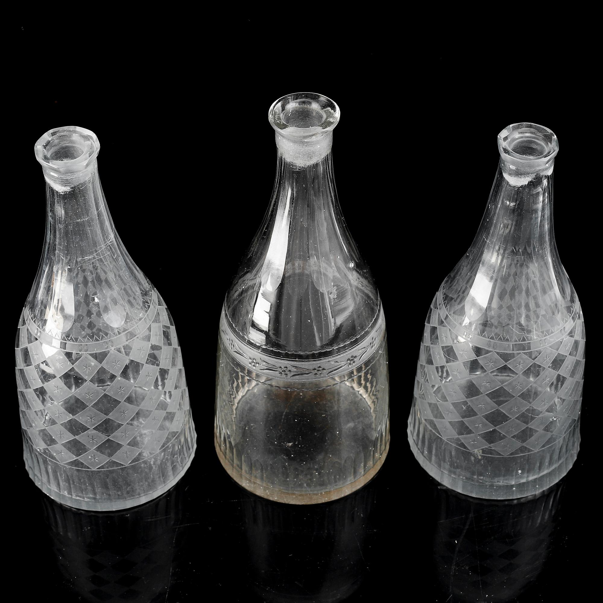 A set of three (2+1) bottles, 19th Century.