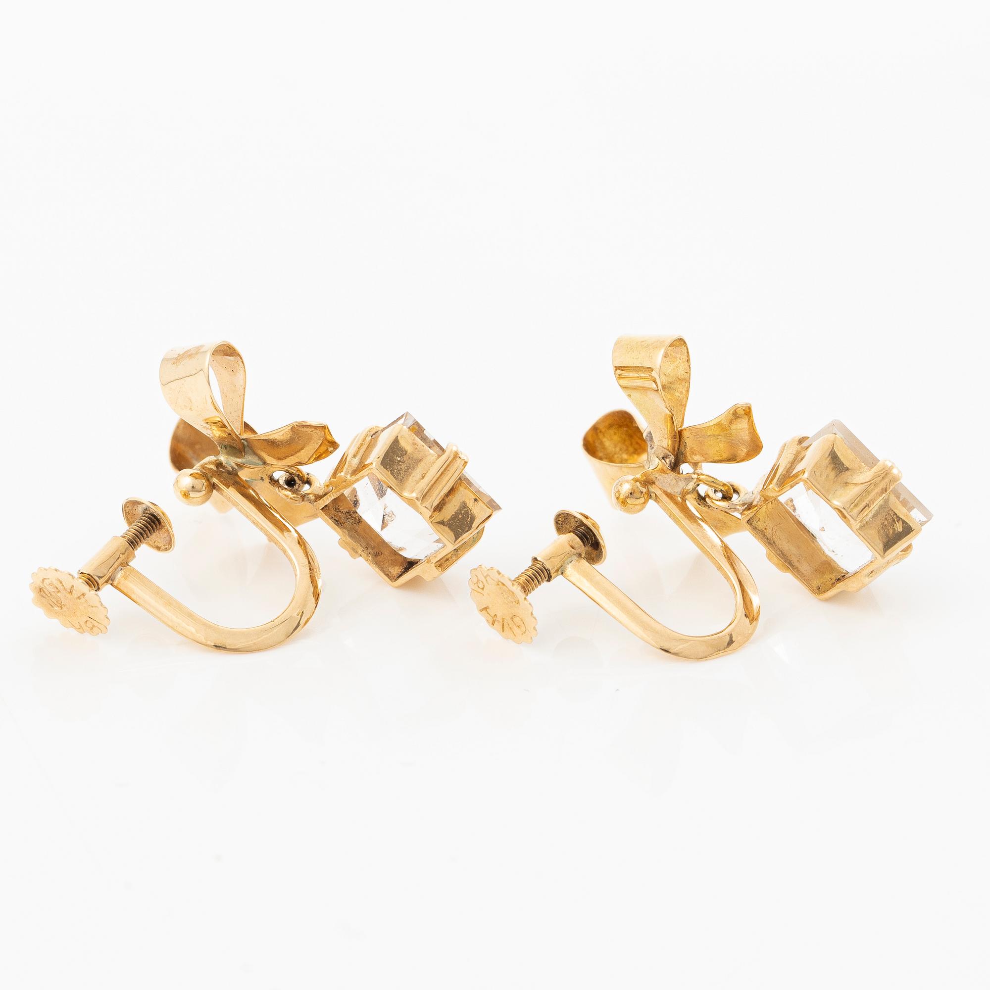 A pair of 18K gold earrings with faceted rock crystal.