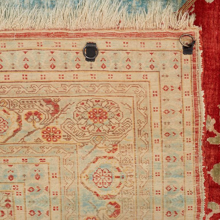 MATTO, an antique silk Tabriz, ca 165 x 122,5 cm.