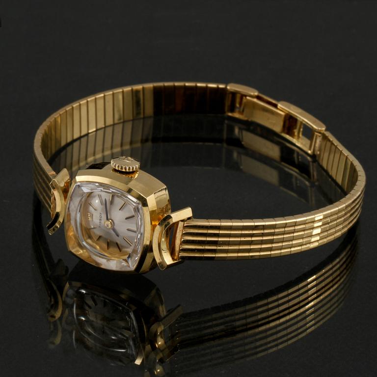 DAMARMBANDSUR, 18k guld, Tissot. Vikt 27 g.