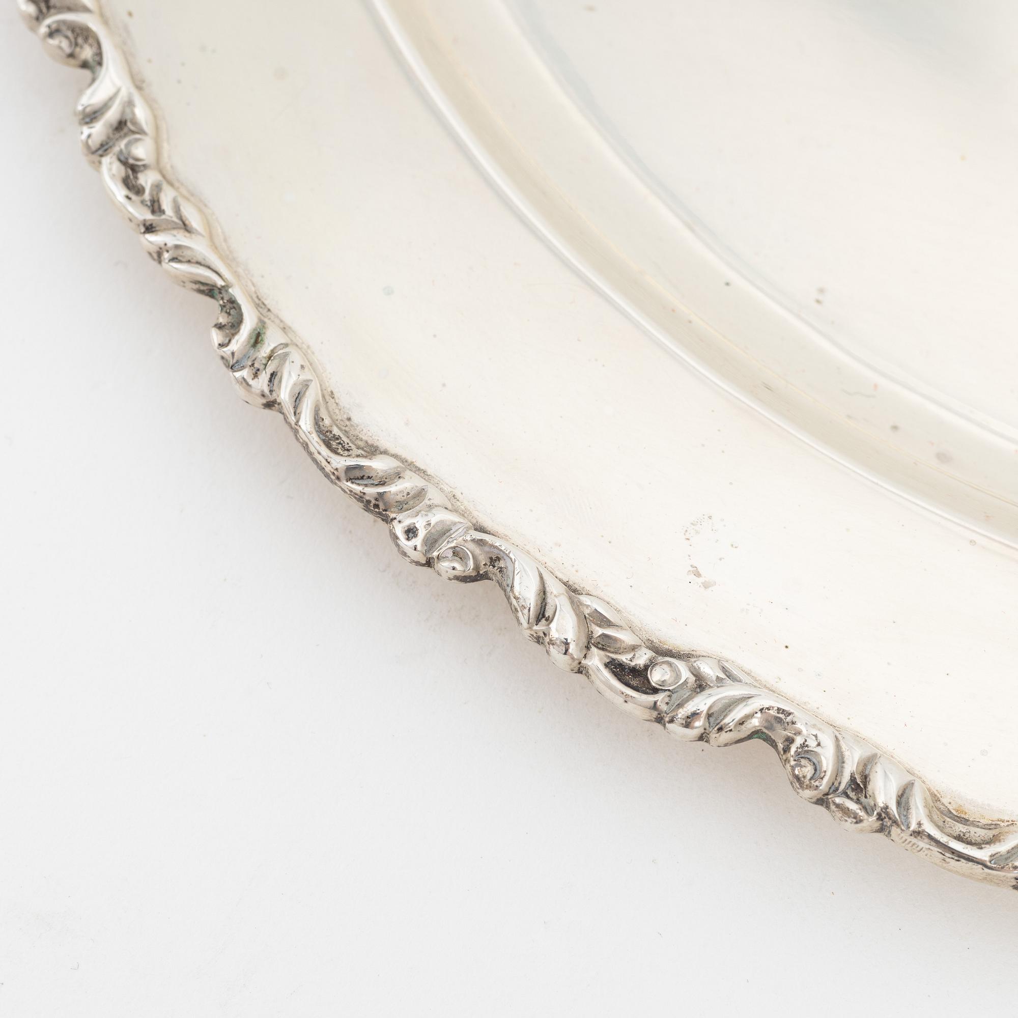 Juventino Lopez Reyes, a set of 12 Rococo style sterling silver dishes, Mexico, 20th Century.