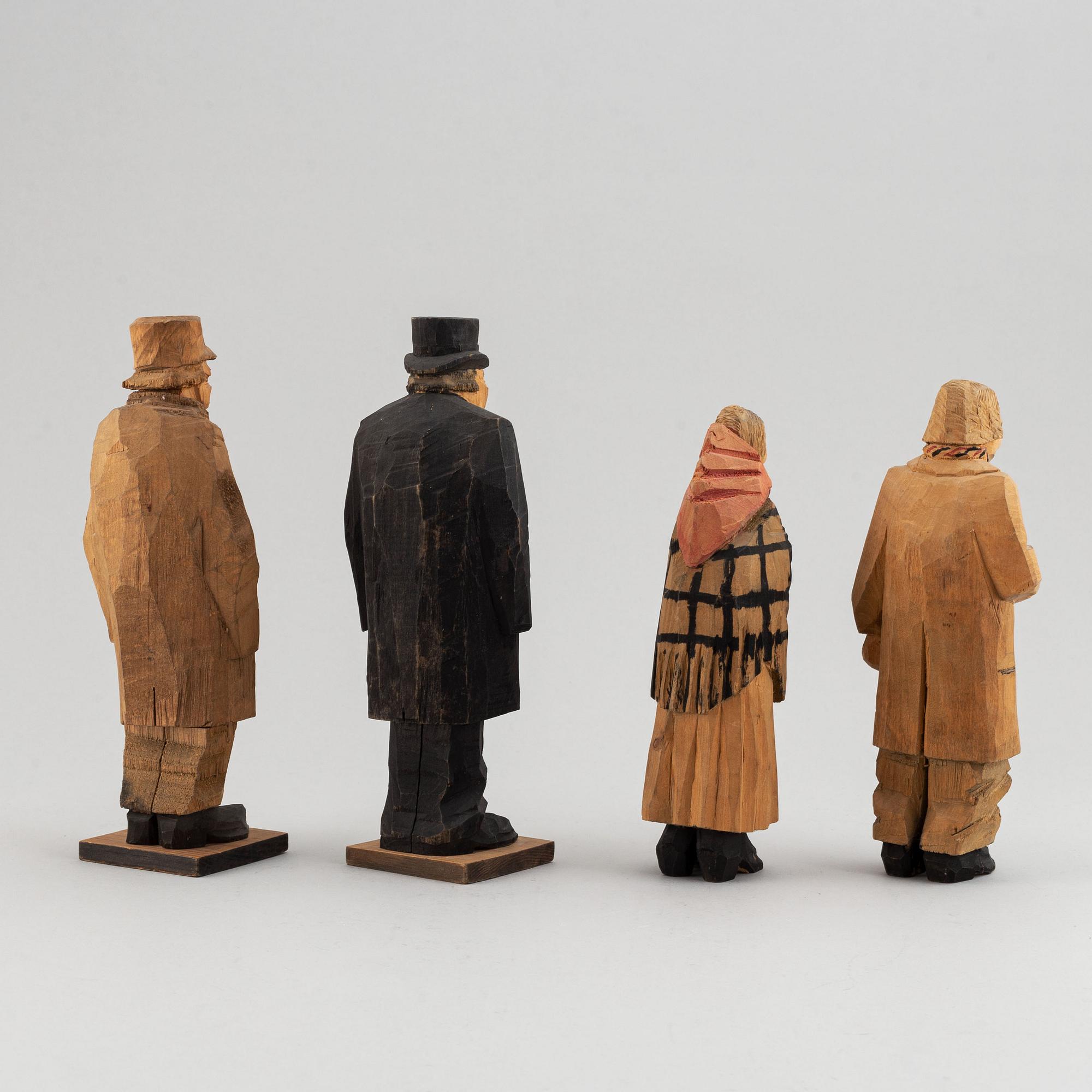 Four Carl Johan Trygg wooden sculptures, two signed and dated 1918.