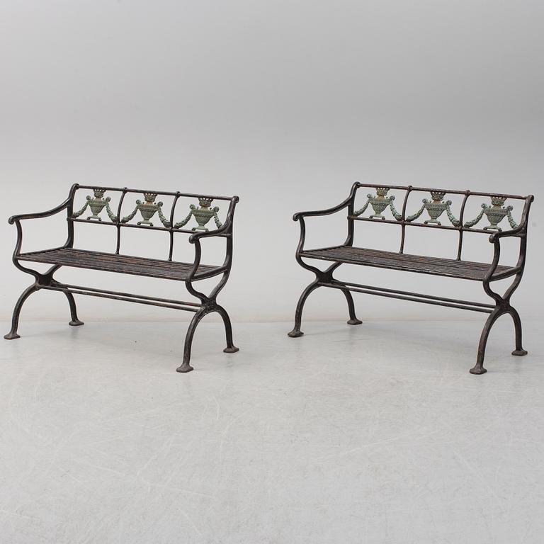 GARDEN SOFAS, a pair, cast iron, empire style, late 19th century.
