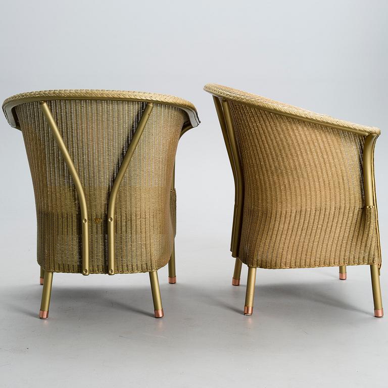 A PAIR OF ARM CHAIRS, Lloyd Loom, Spalding, England, turn of the 21st century.
