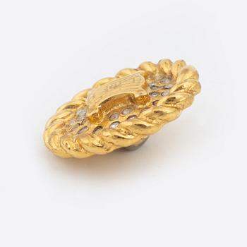 Céline, a set of four gold tone brooches.