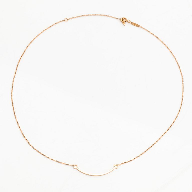 Tiffany & Co, an 18K gold 'T Smile' necklace.