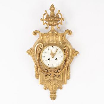 A bronze wall clock, Louis XVI style, France, circa 1900.