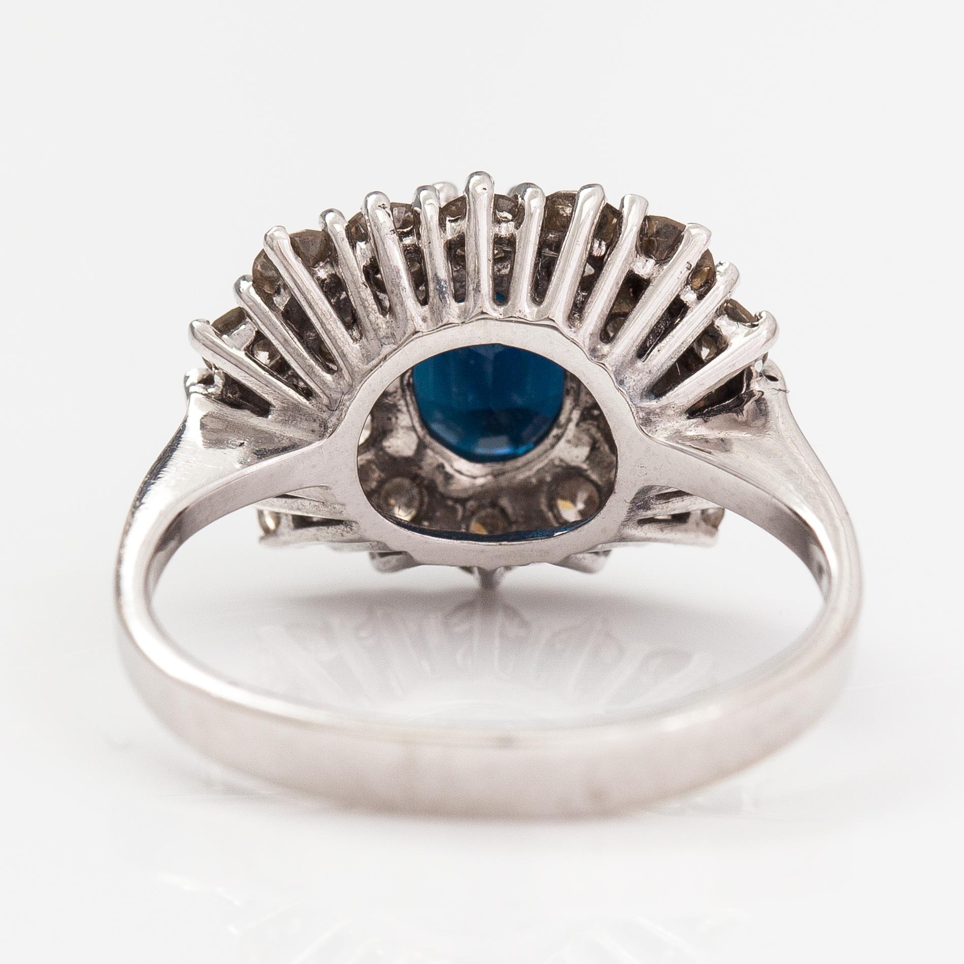 A 14K white gold ring with a sapphire ca. 1.24 ct and diamonds ca 1.25 ct in total. Finnsh import marks 1994.