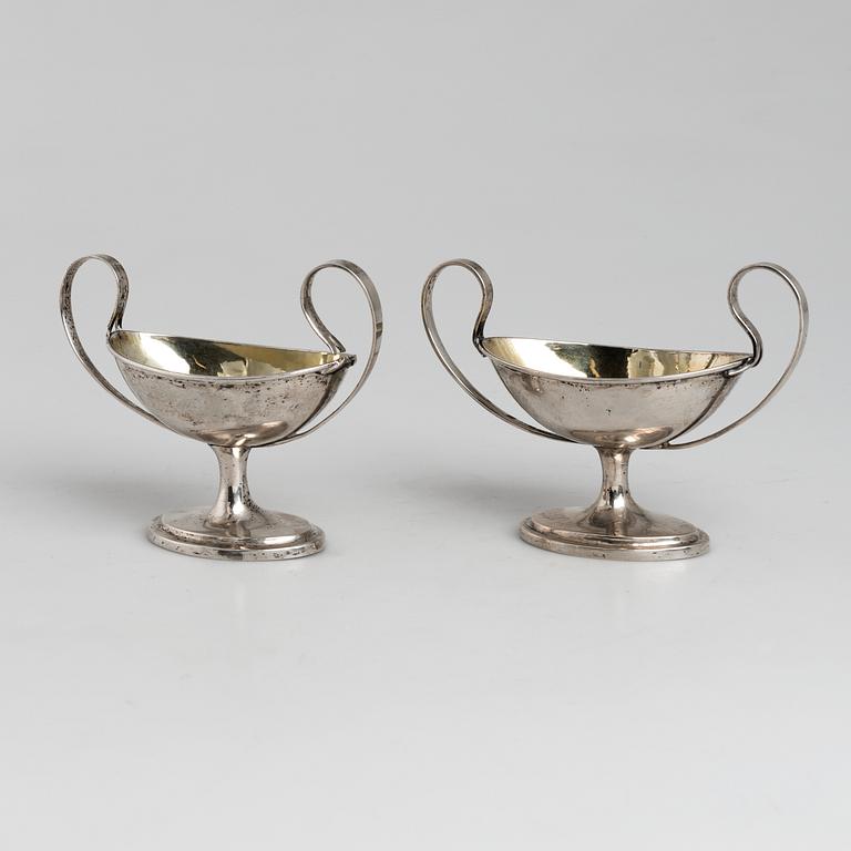 A pair of firt half of the 19th century parcel-gilt silver salt-cellars by an uknown master, one marked HB.