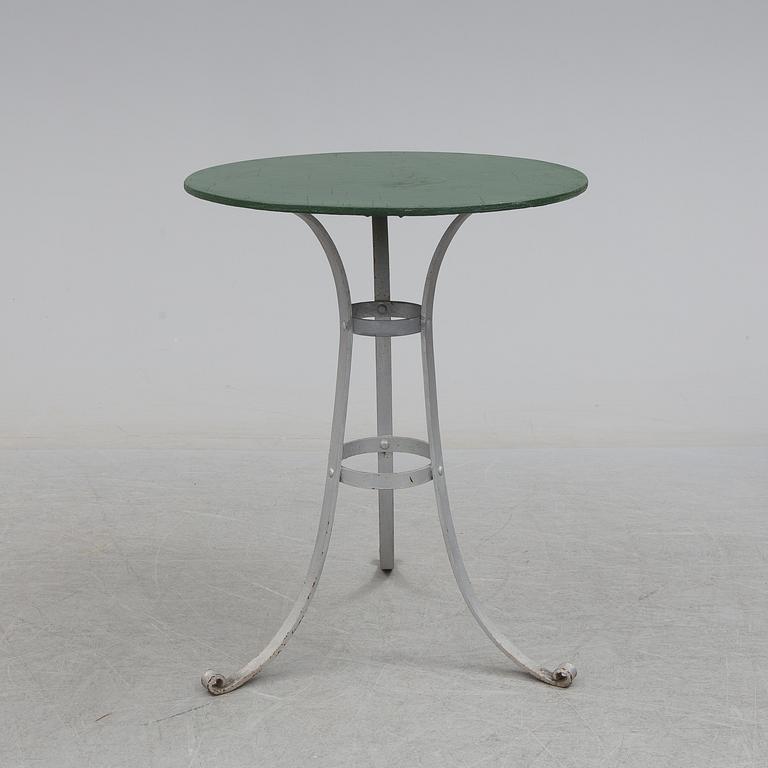 A garden table and four chairs, first half of the 20th century.