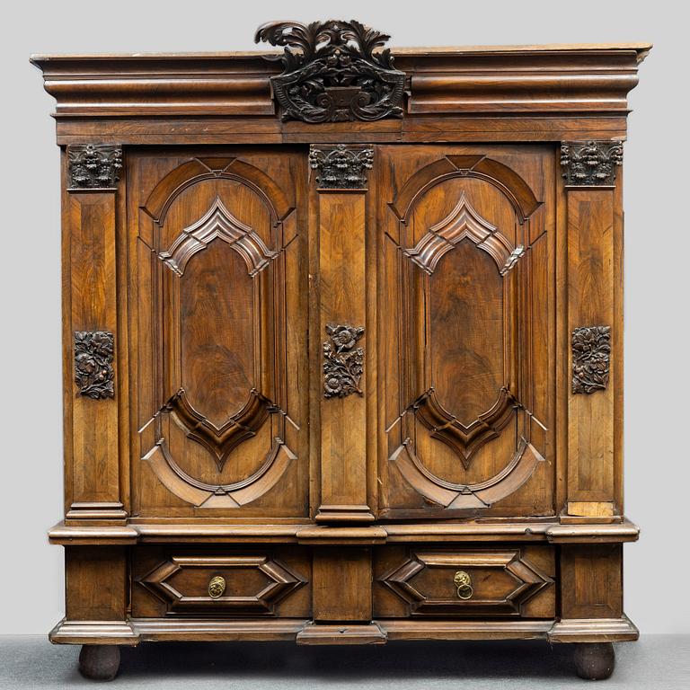 A walnut veneered Baroque cabinet, from around the year 1700.