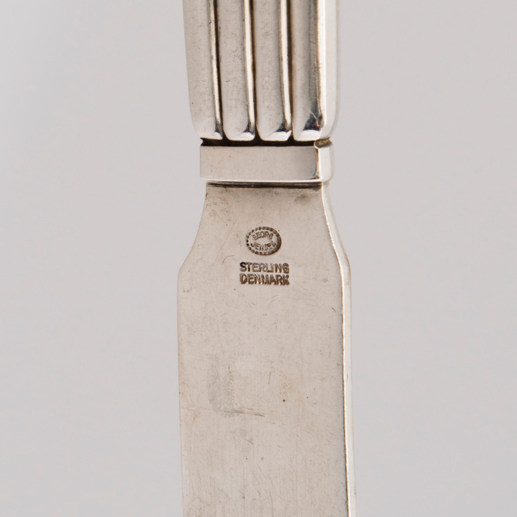 A 106 PIECE SILVER 'Bernadotte' cutlery set for George Jensen Denmark 1945-1977.