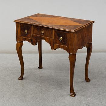 A late Baroque-style table, circa 1900.