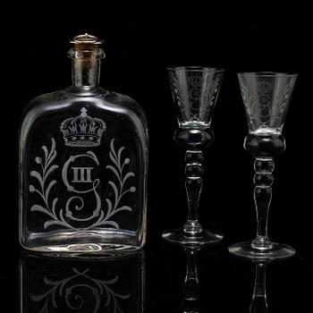 A set of five snapps glasses and a snapps bottle, with Gustav III crowned monogram. 20th century, Baroque-style.