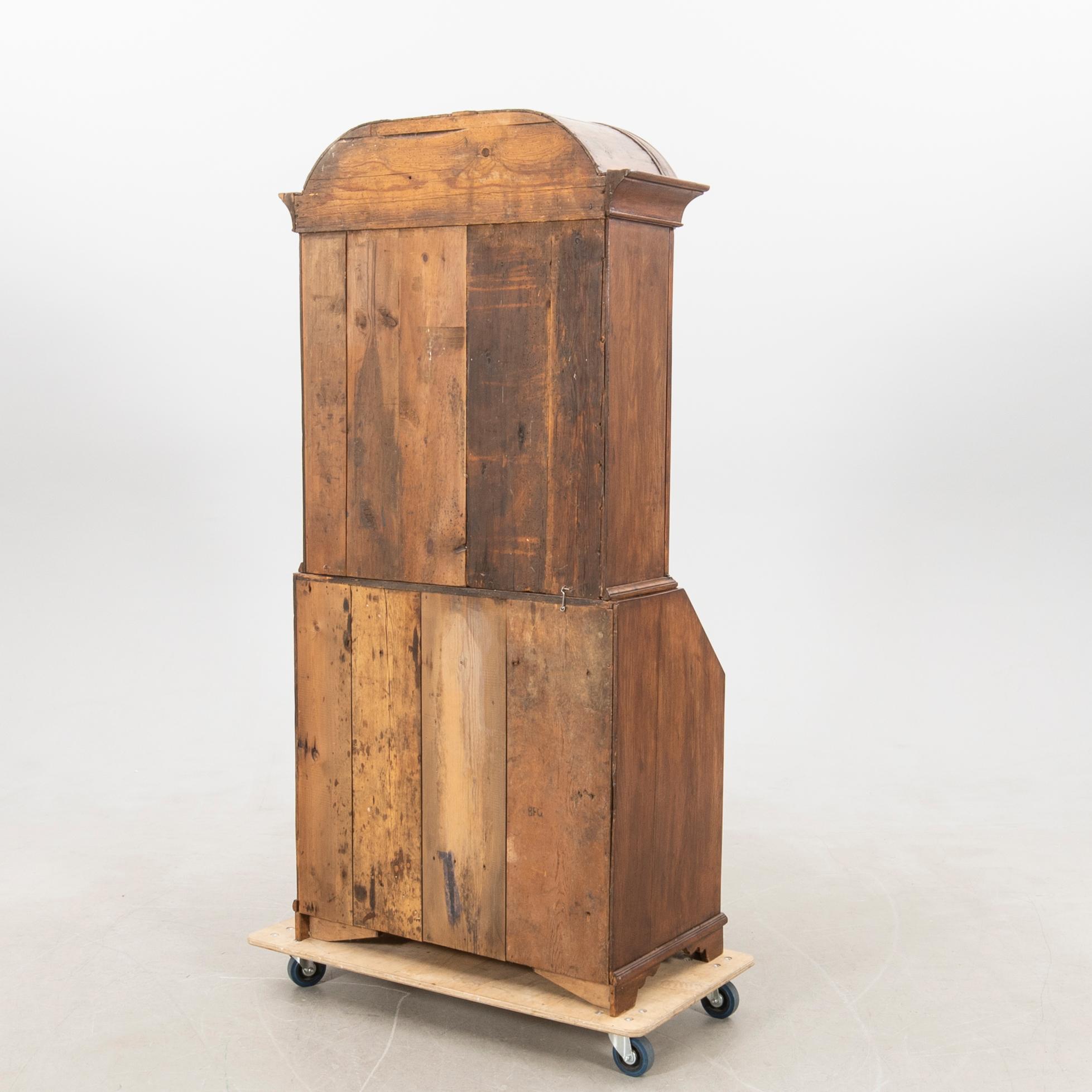 Slant-front secretary with a glazed section, 18th century.