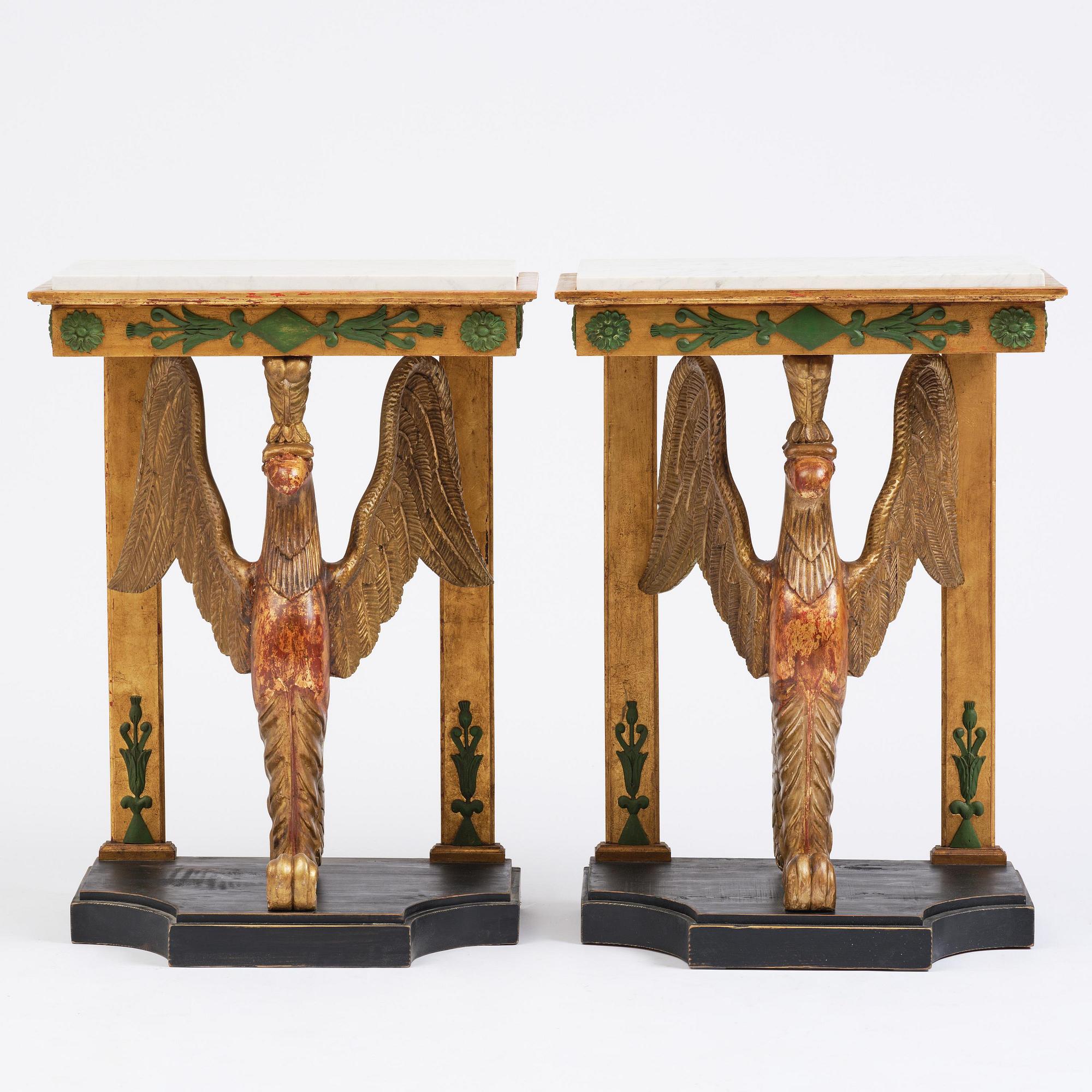 A pair of giltwood console tables, Empire-style incorporating older elements.