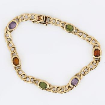ARMBAND, 14K guld med olikfärgade stenar, sannolikt ametister, citriner och peridoter, Italien. Vikt 12,89 gram.