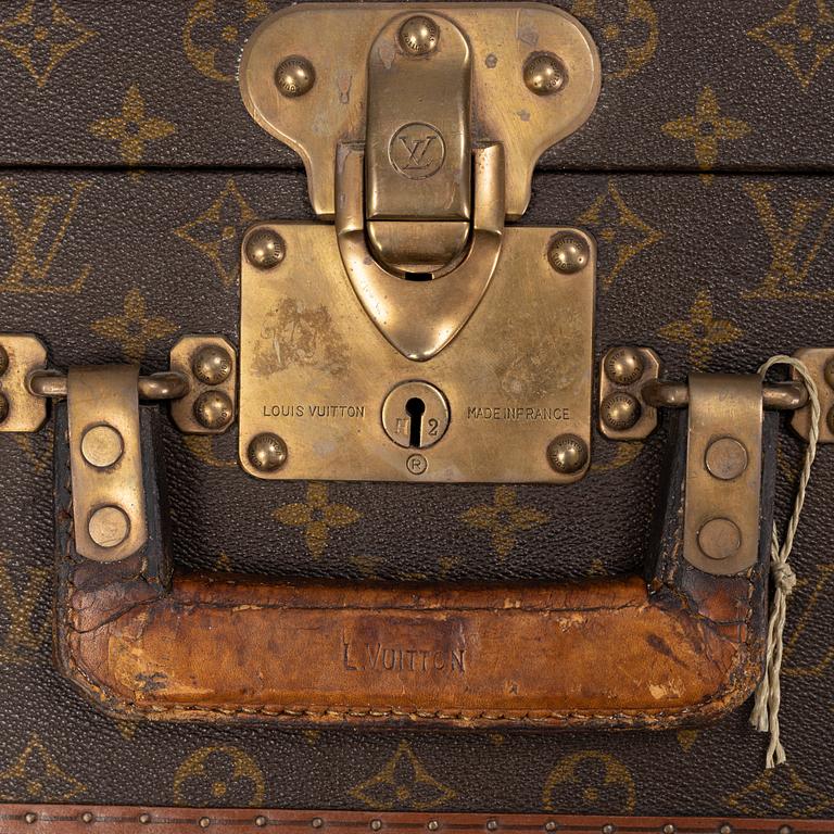 Louis Vuitton, a monogram canvas 'Bracken' suitcase, mid 20th Century.