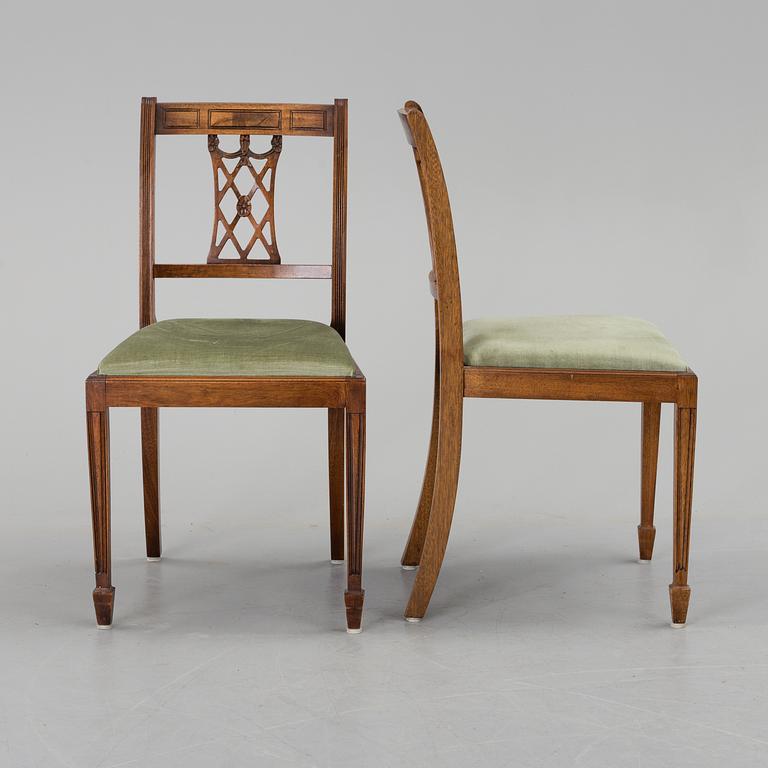 A set of eight chairs and a dining table, second half of the 20th century.