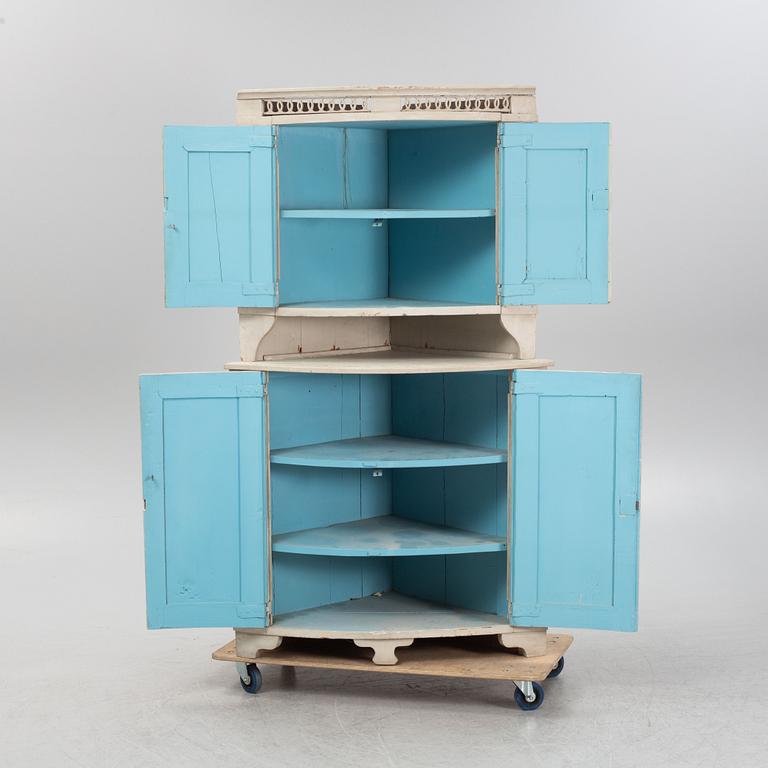 A Gustavian corner cabinet, 19th century.