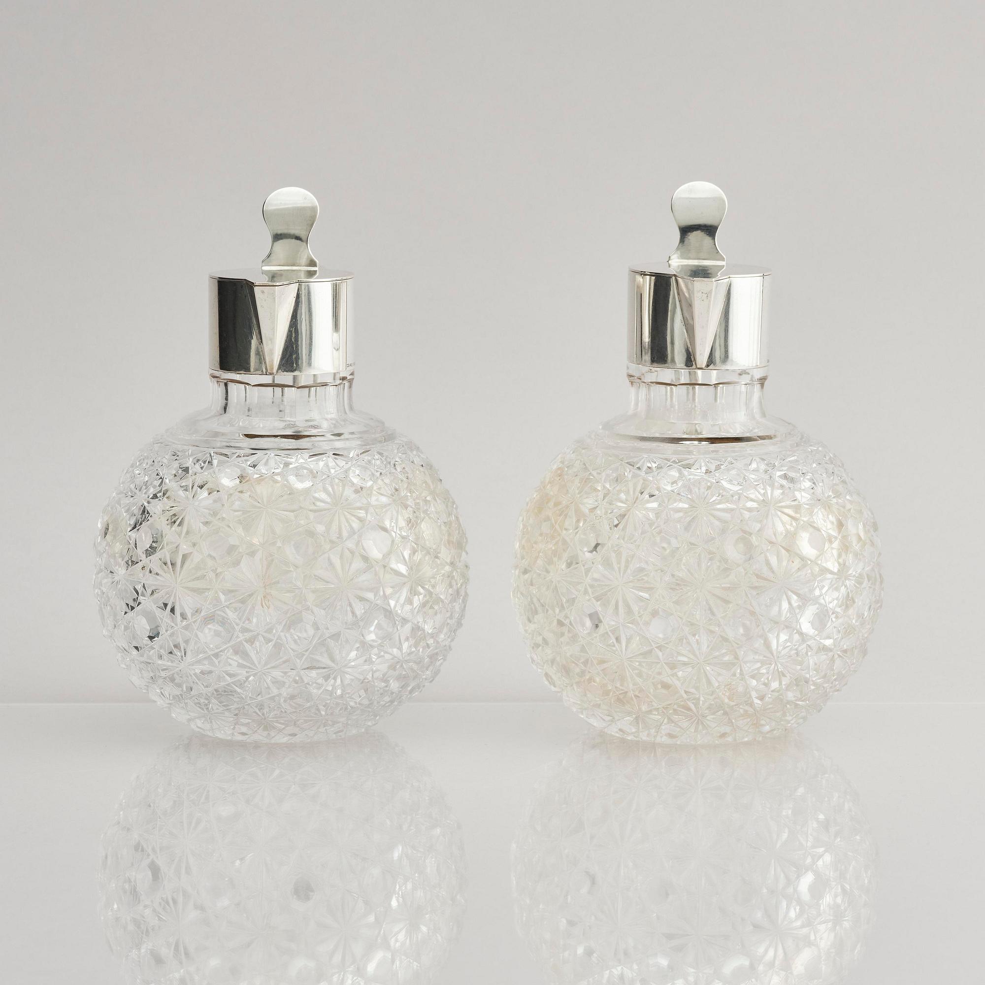 A Swedish pair of silver and cut-glass decanters, mark of C.G. Hallberg, Stockholm 1893.