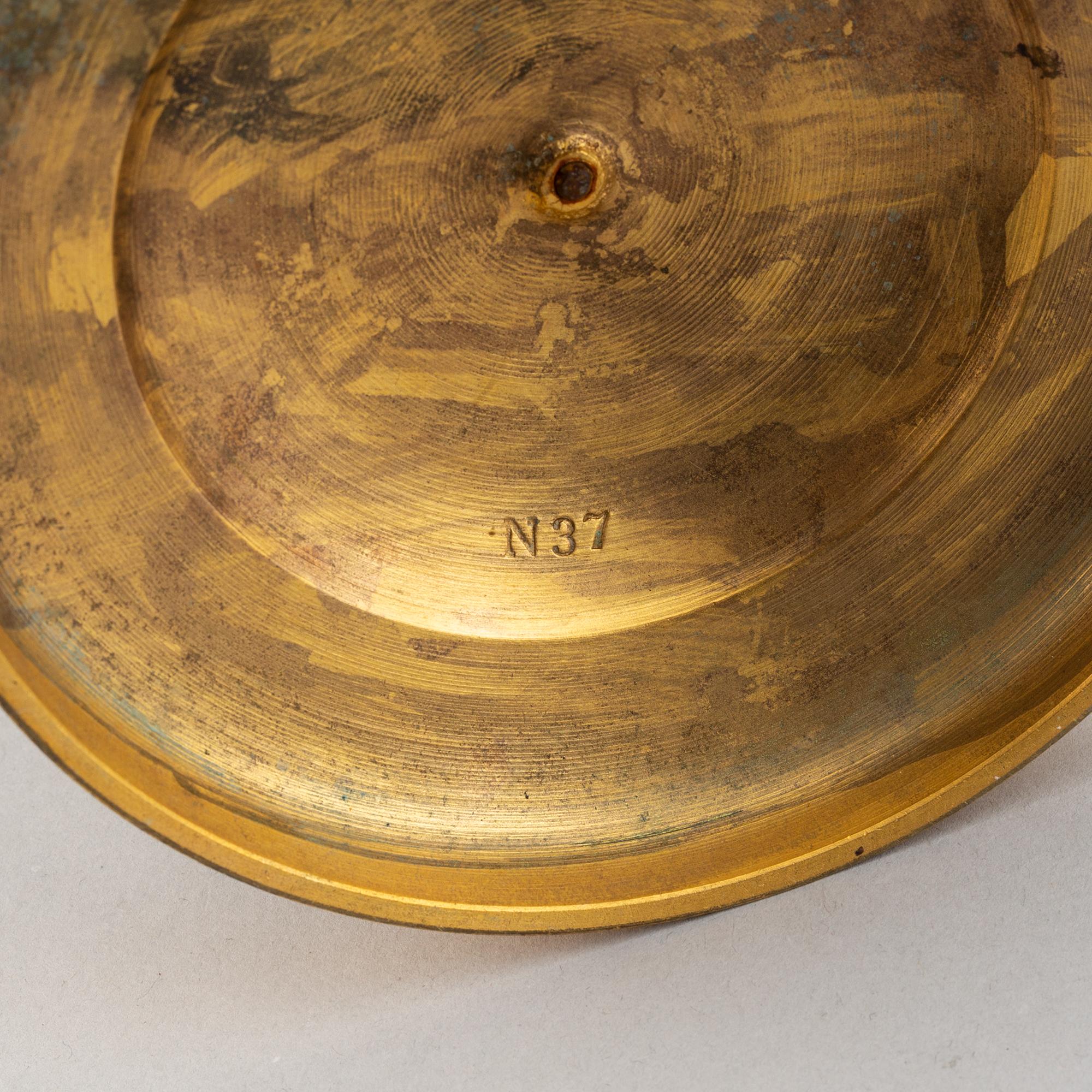 A pair of French Empire candlesticks.