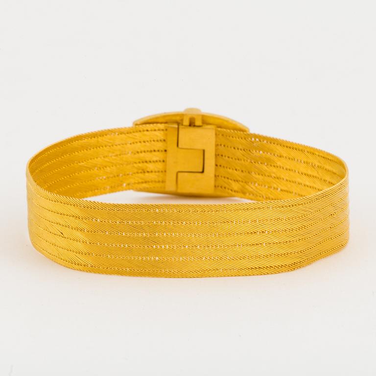 BRACELET, 18K gold shaped as a belt.