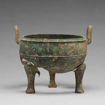 A bronze tripod food vessel and cover, "Ding", Eastern Zhou Dynasty.