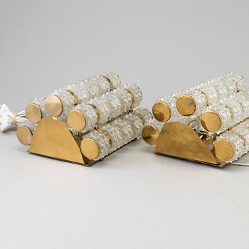 A pair of 1970's glass and brass wall lamps.