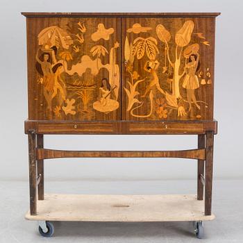 a 1930's Swedish Modern 'Tahiti' intarsia cabinet from Reiners Mjölby, Sweden.