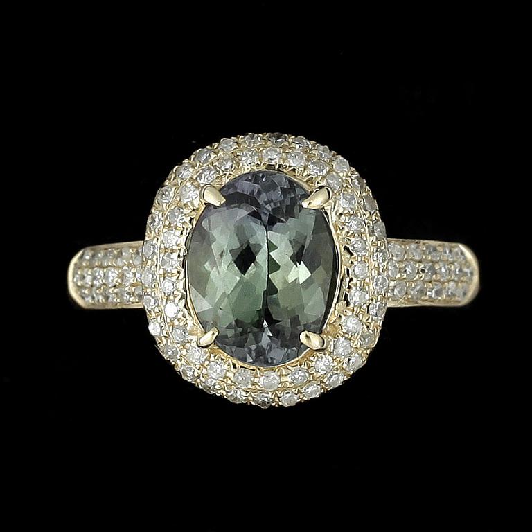 RING, 14k guld med grön zoisit enl certifikat ca2,12ct och små diamanter.. 2000-tal. Vikt 4g.