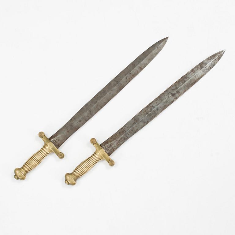 A pair of French military daggers from the first half of the 19th century.