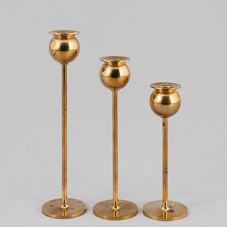 Pierre Forssell, A set of three 'Tulip' brass candlesticks by Skultuna Bruk, 1993.