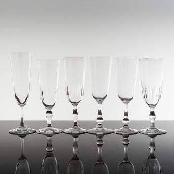 18 glass champagne flutes, ca 1900.