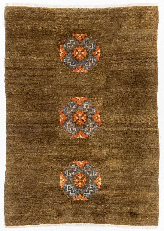 A Tibetan rug, c. 240 x 170 cm.