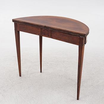 A mahogany-veneered table, presumably Denmark, Empire, first half of the 19th century.