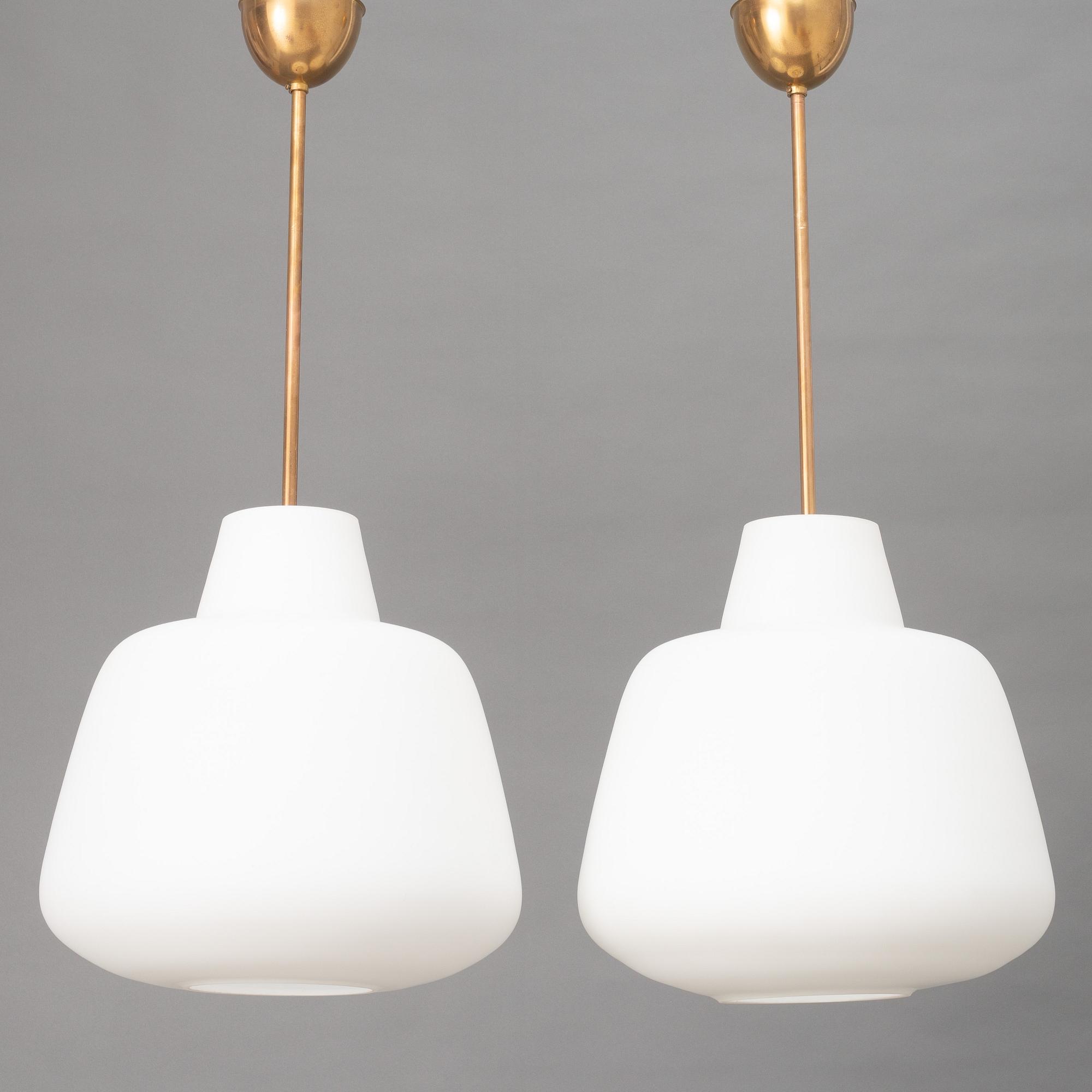 A pair of Swedish Modern ceiling lamps, mid 20th century.