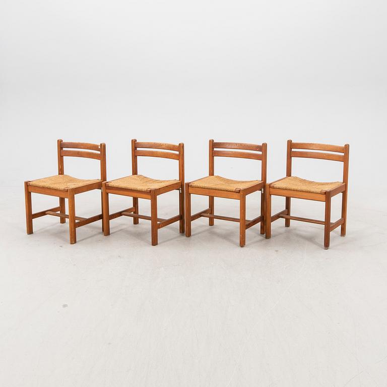 A set of four 1970s pine chairs.