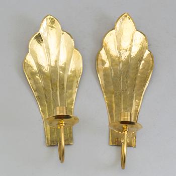 A pair of brass wall scones by Lars Holmström, Arvika.