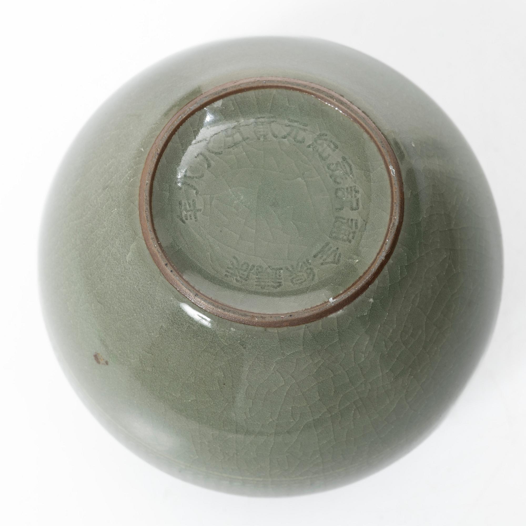 A Korean celadon glazed ceramic vase, 1900s.