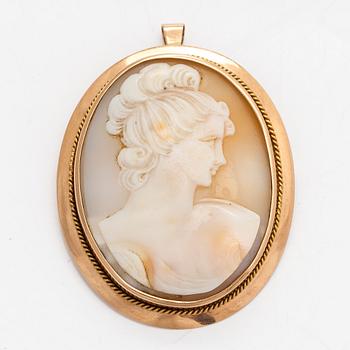 A 14K gold pendant/brooch with shell cameo.