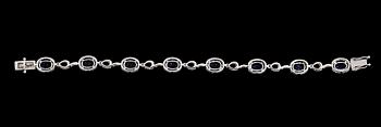 ARMBAND, 18K vitguld, diamanter tot ca 1.65 ct, 8 tanzaniter tot ca 5.70 ct.