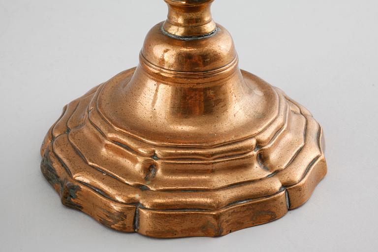 A pair of late barouqe bronze candlesticks, 18th century.