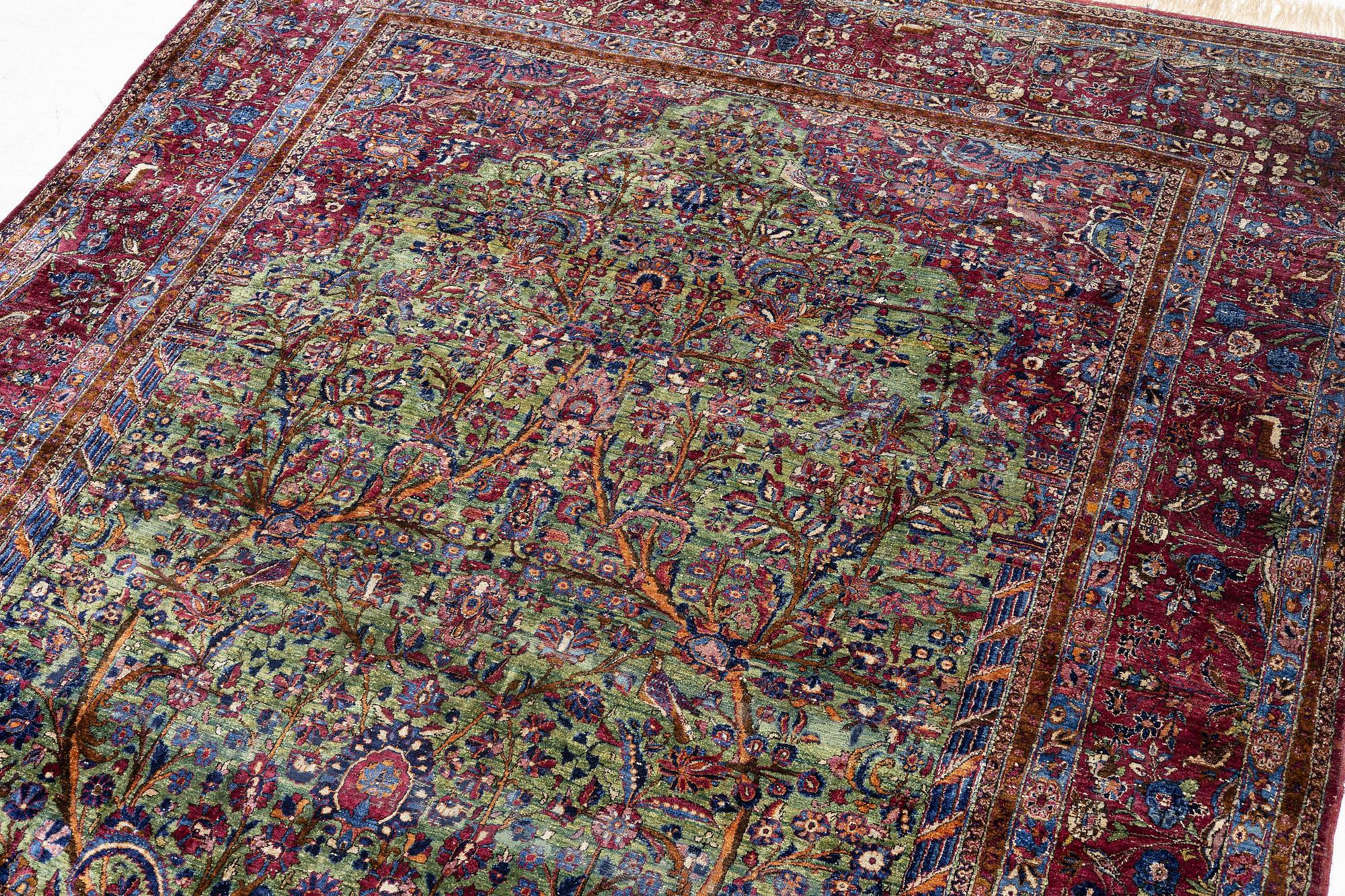An antique silk Kashan carpet, central Persia, c. 319 x 206 cm.