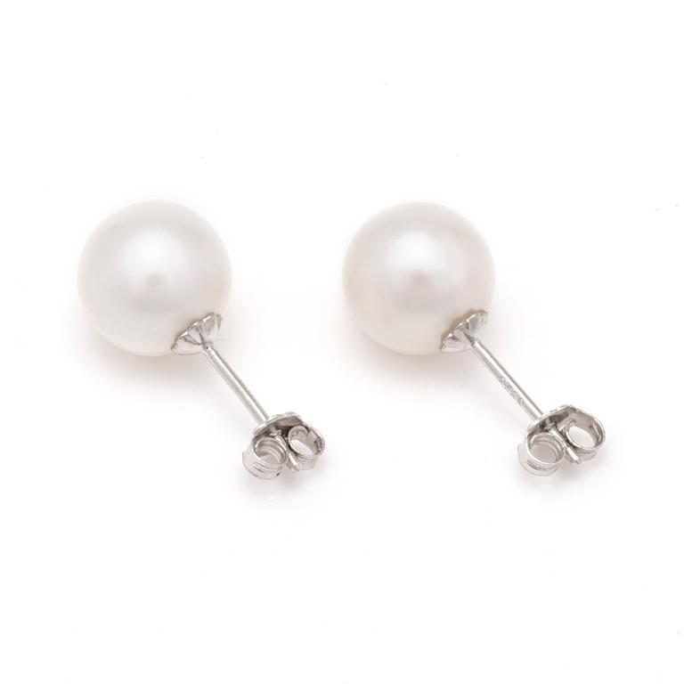 A pair of cultured pearl earrings.