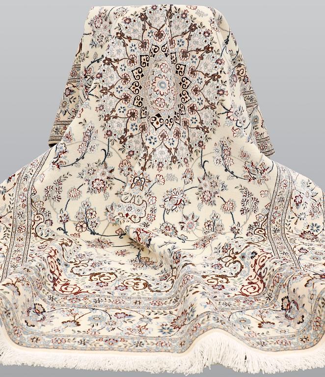A Nain part silk carpet, 244 x 156 cm.