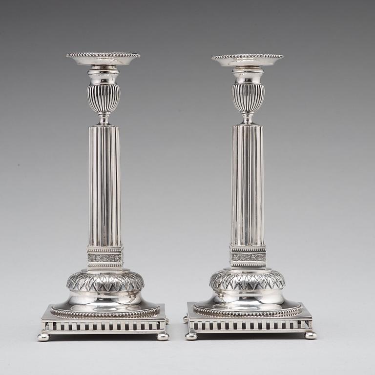 A pair of Swedish 18th century silver candlesticks, Stephan Westerstråhle, Stockholm 1793, one nozzle J E Torsk 1895.