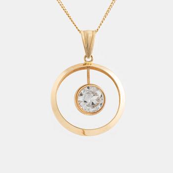 An 18K gold pendant with chain.