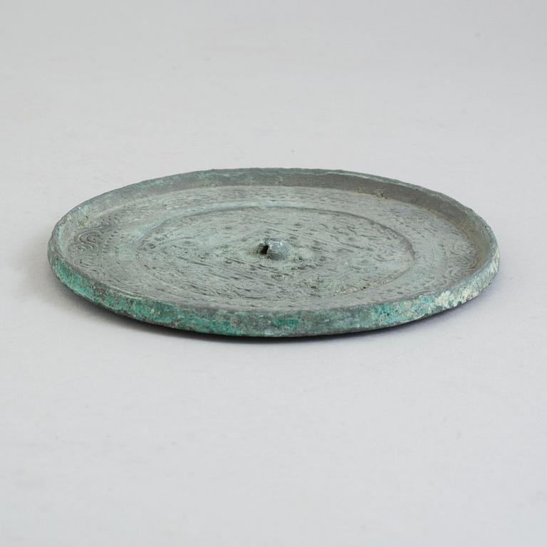 A bronze mirror, Xin-Eastern Han dynasty (9-220).