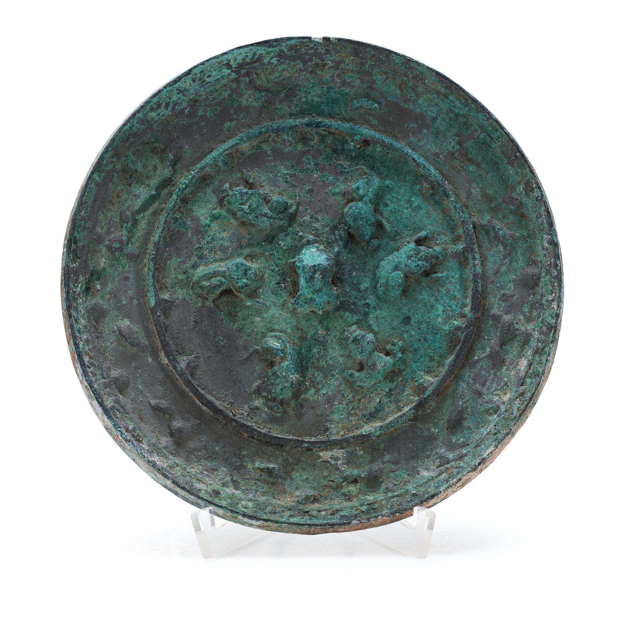 A broze mirror, presumably Tang dynasty (618-907 A.D.).